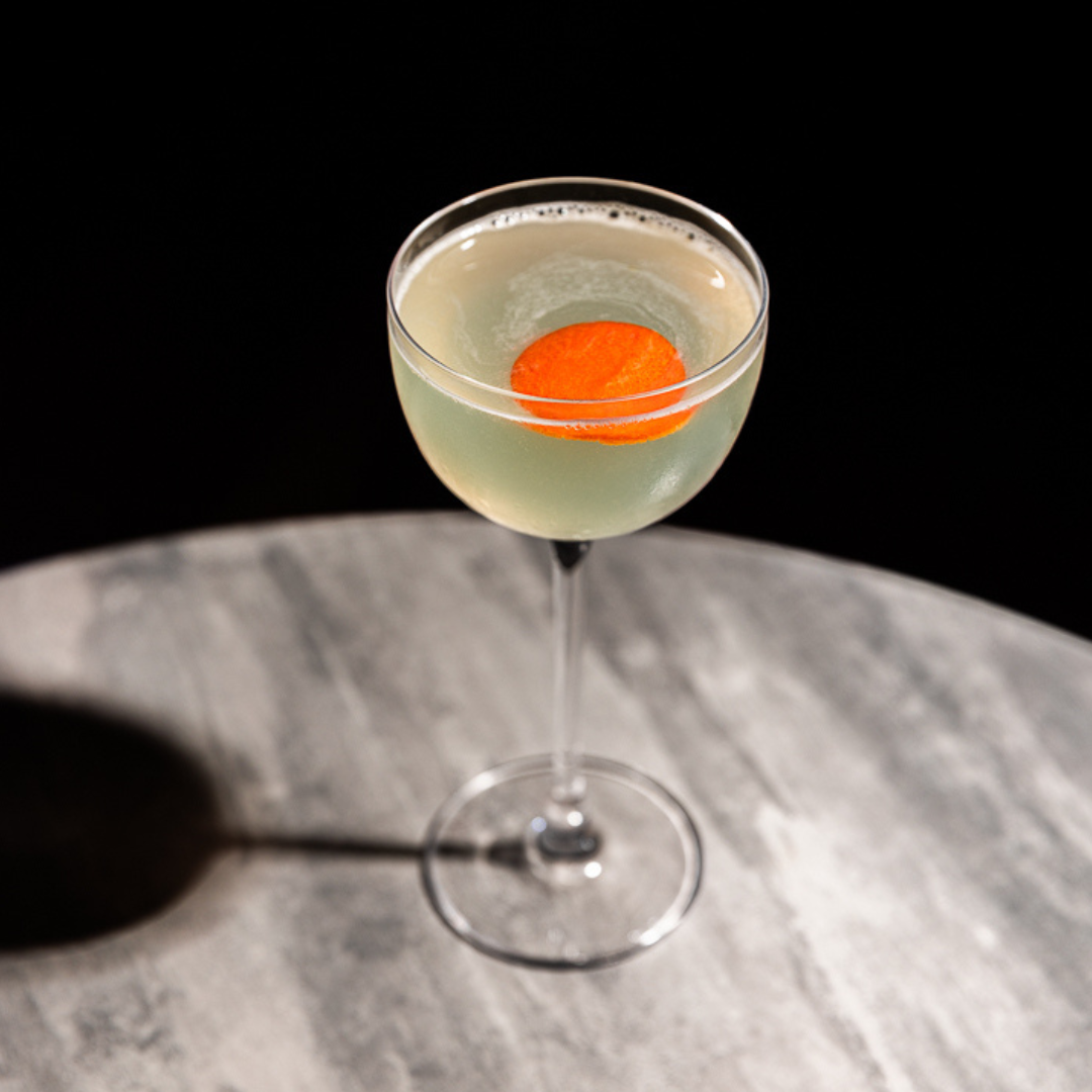 Europe Calling cocktail, garnished with an orange twist, combines Kabina rakija and sherry